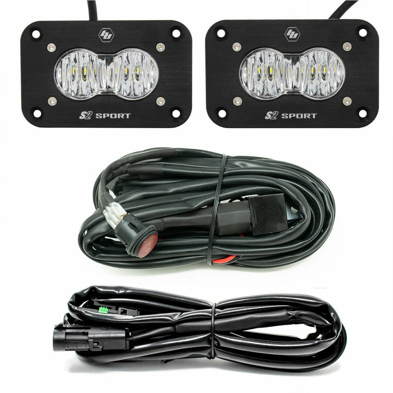 Baja Designs S2 Sport Black Flush Mount LED Light Pod Reverse Kit, complete kit on a studio background: two black flush mount S2 Sport pods with clear lenses plus two wiring harnesses on a white background