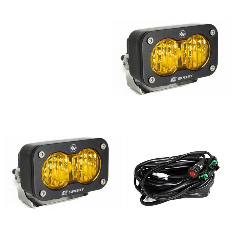 Baja Designs S2 Sport Black LED Auxiliary Light Pod Pair, whole product on a studio background: pair of black S2 Sport light pods with amber fluted lenses and a wiring harness on a white background