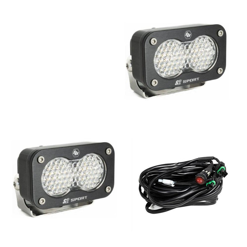 Baja Designs S2 Sport Black LED Auxiliary Light Pod Pair, whole product on a studio background: pair of black S2 Sport light pods with clear dimpled work scene lenses and a wiring harness on a white background