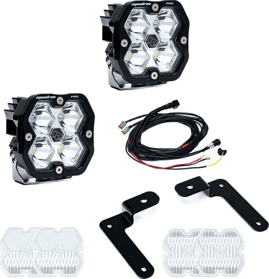 A-Pillar Light Kits by Baja Designs: A Squadron Pro A-pillar light kit with two pods, black angled brackets, harness and spare clear lens covers on white.