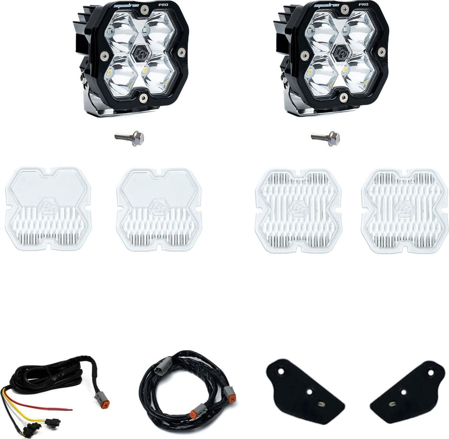 A-Pillar Light Kits by Baja Designs: Two Squadron Pro pods, mounting bolts, spare clear lens covers, two harness sections and two small black brackets on white.