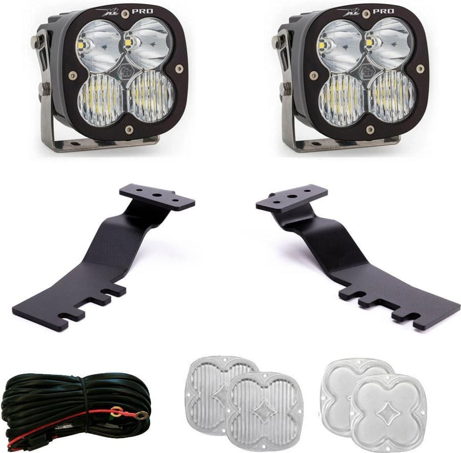 A-Pillar Light Kits by Baja Designs: Two XL Pro pods, two black A-pillar brackets, a wiring harness and spare clear lens covers on white.