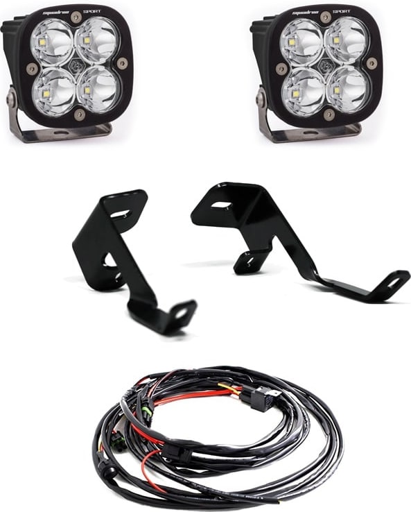 A-Pillar Light Kits by Baja Designs: Two Squadron LED pods with clear lenses, two A-pillar brackets and a wiring harness on white.