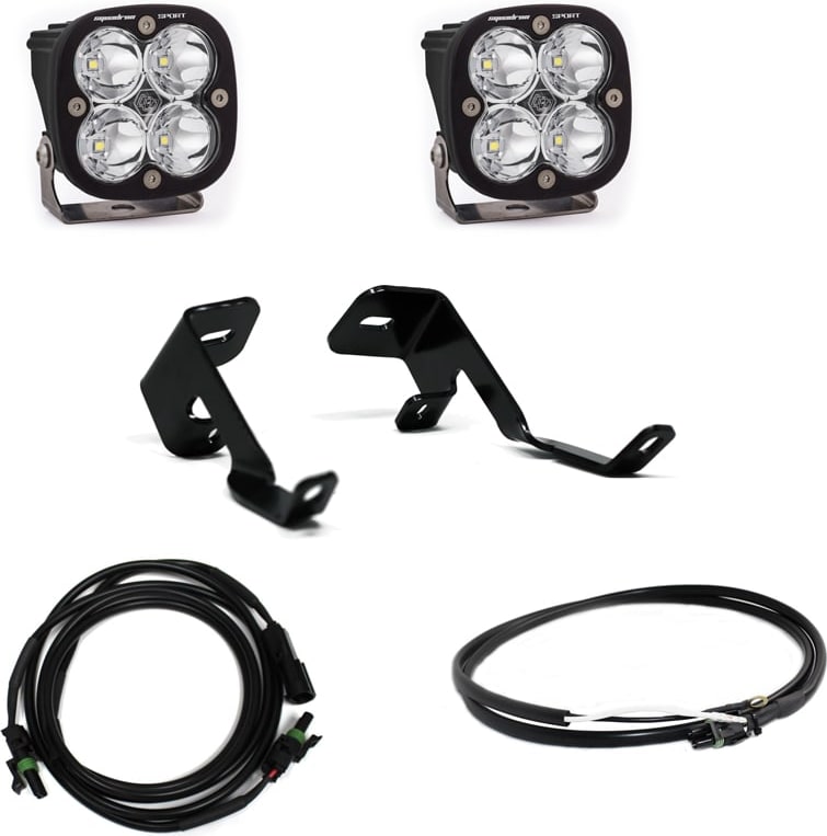 A-Pillar Light Kits by Baja Designs: Two Squadron Sport LED pods with clear lenses, two A-pillar brackets, a harness and an extension lead on white.