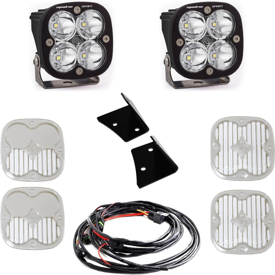 A-Pillar Light Kits by Baja Designs: Two black Squadron Sport pods with clear lenses shown with black angle brackets, a wiring harness and four clear lens covers on white.