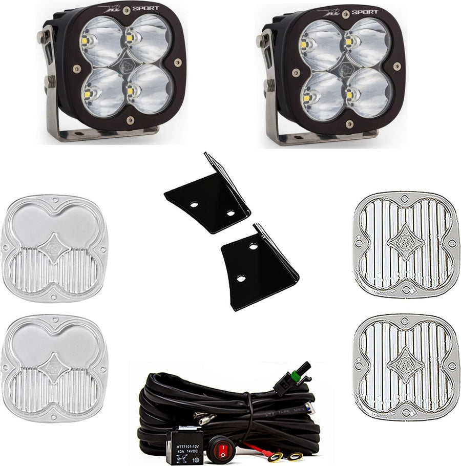 A-Pillar Light Kits by Baja Designs: Two black XL Sport pods with clear lenses shown with black angle brackets, a switched relay harness and four clear lens covers on white.