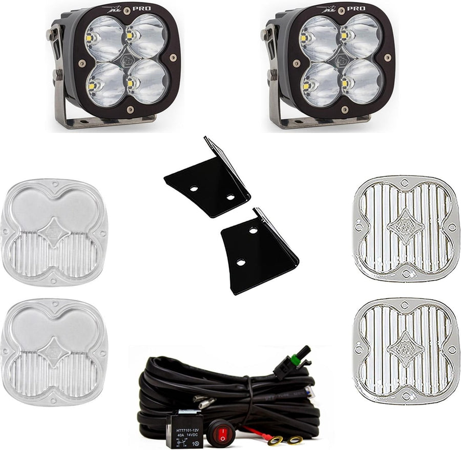 A-Pillar Light Kits by Baja Designs: Two black XL Pro pods with clear lenses shown with black angle brackets, a switched relay harness and four clear lens covers on white.
