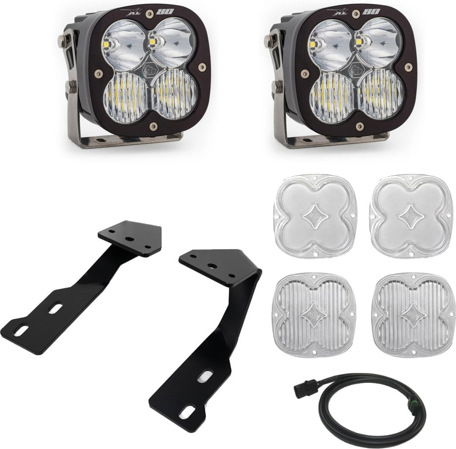 A-Pillar Light Kits by Baja Designs: Two black XL 80 pods with clear lenses shown with black A-pillar brackets, four clear lens covers and a harness on white.