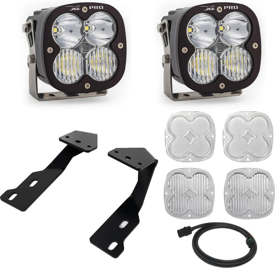 A-Pillar Light Kits by Baja Designs: Two black XL Pro pods with clear lenses shown with black A-pillar brackets, four clear lens covers and a harness on white.