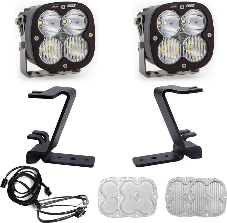 A-Pillar Light Kits by Baja Designs: A pair of Baja Designs XL80 LED pods with black A-pillar mounting brackets and wiring laid out on a white background.