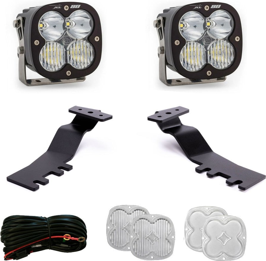 A-Pillar Light Kits by Baja Designs: A pair of XL80 LED pods with two A-pillar brackets, a wiring harness and two clear lens covers on white.