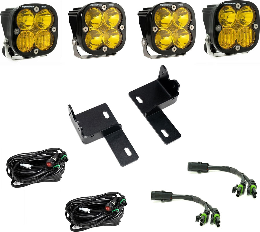Grille Light Kits by Baja Designs: Four amber-lens Squadron Pro LED pods with two grille brackets, two switched harnesses and two splitter harnesses on white.