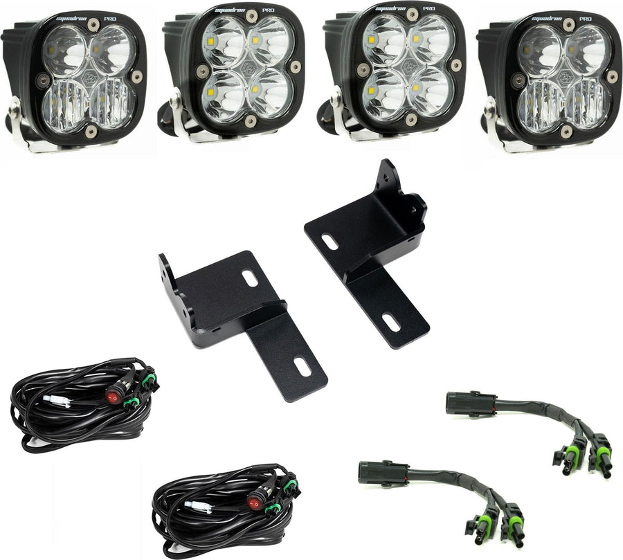 Grille Light Kits by Baja Designs: Four clear-lens Squadron Pro LED pods with two grille brackets, two switched harnesses and two splitter harnesses on white.