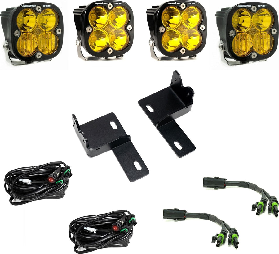Grille Light Kits by Baja Designs: Four amber-lens Squadron Sport LED pods with two grille brackets, two switched harnesses and two splitter harnesses on white.