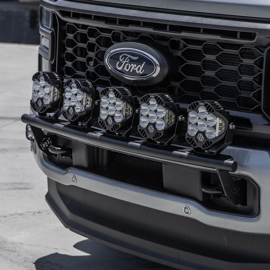 Bumper Light Kits by Baja Designs: A row of LED pods on a black bull bar across the grille of a gray Ford truck.