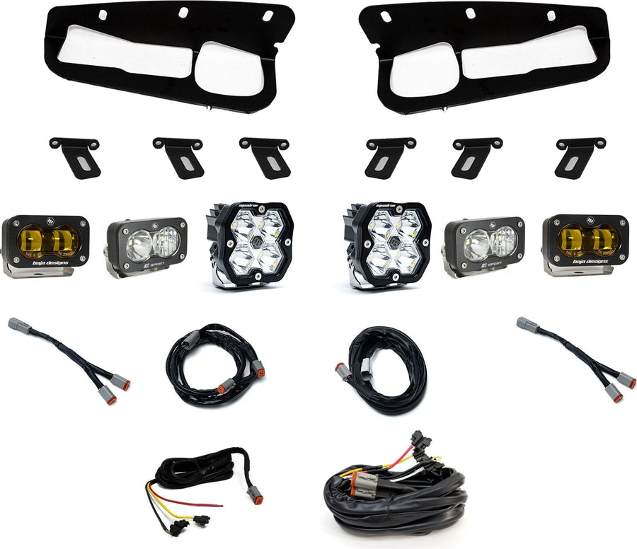 Fog Light Kits by Baja Designs: Fog pocket light kit laid out on white: two black bezels, mounting brackets, two Squadron pods, four S2 pods and wiring harnesses. The outer SAE fog pods have amber lenses.