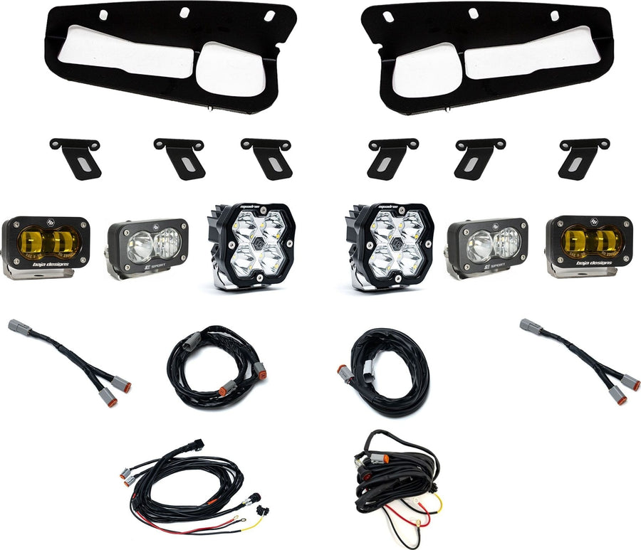 Fog Light Kits by Baja Designs: Fog pocket light kit laid out on white: two black bezels, mounting brackets, two Squadron pods, four S2 pods and wiring harnesses. The outer SAE fog pods have amber lenses.