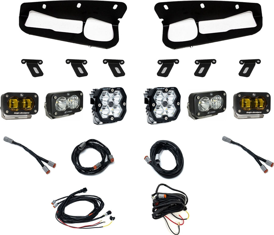 Fog Light Kits by Baja Designs: Fog pocket light kit laid out on white: two black bezels, mounting brackets, two Squadron pods, four S2 pods and wiring harnesses. The outer SAE fog pods have amber lenses.