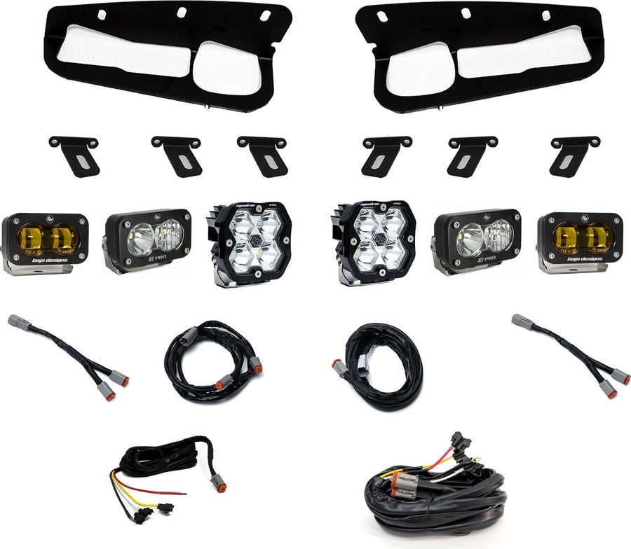 Fog Light Kits by Baja Designs: Fog pocket light kit laid out on white: two black bezels, mounting brackets, two Squadron pods, four S2 pods and wiring harnesses. The outer SAE fog pods have amber lenses.