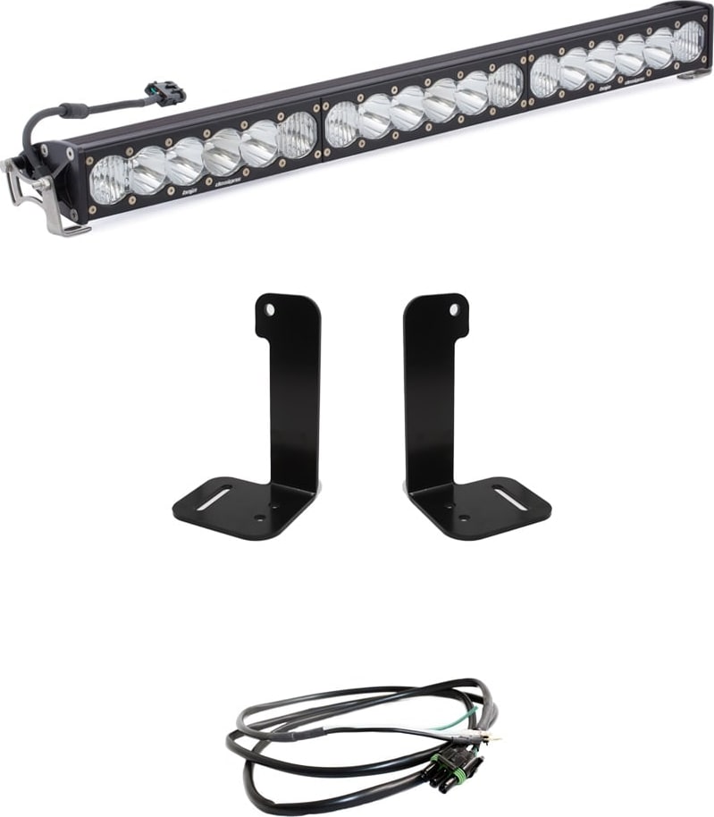 Bumper Light Kits by Baja Designs: A 30-inch OnX6+ light bar on white with two upright bumper brackets and a short pigtail harness.