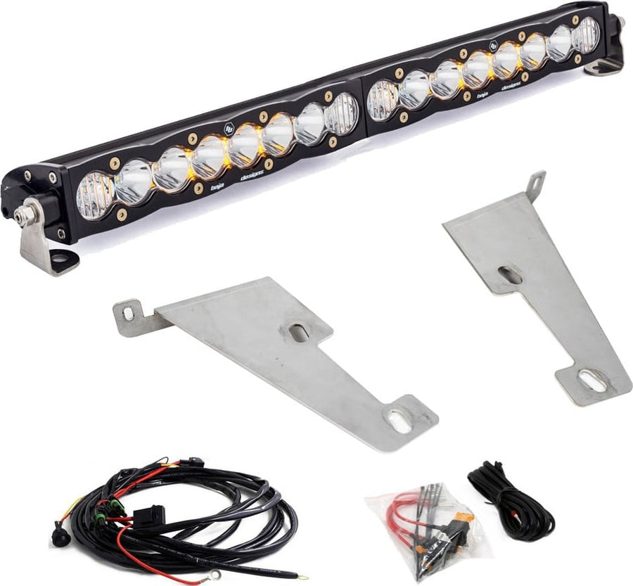 Bumper Light Kits by Baja Designs: An S8 light bar with clear lenses shown with two bare steel brackets, a wiring harness and a hardware bag on white.