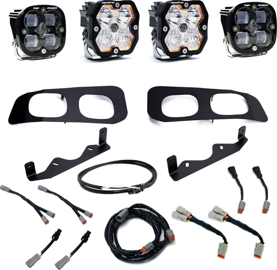 Fog Light Kits by Baja Designs: Dual fog pocket kit with four square pods, two black twin bezels, two brackets and wiring harnesses on white.