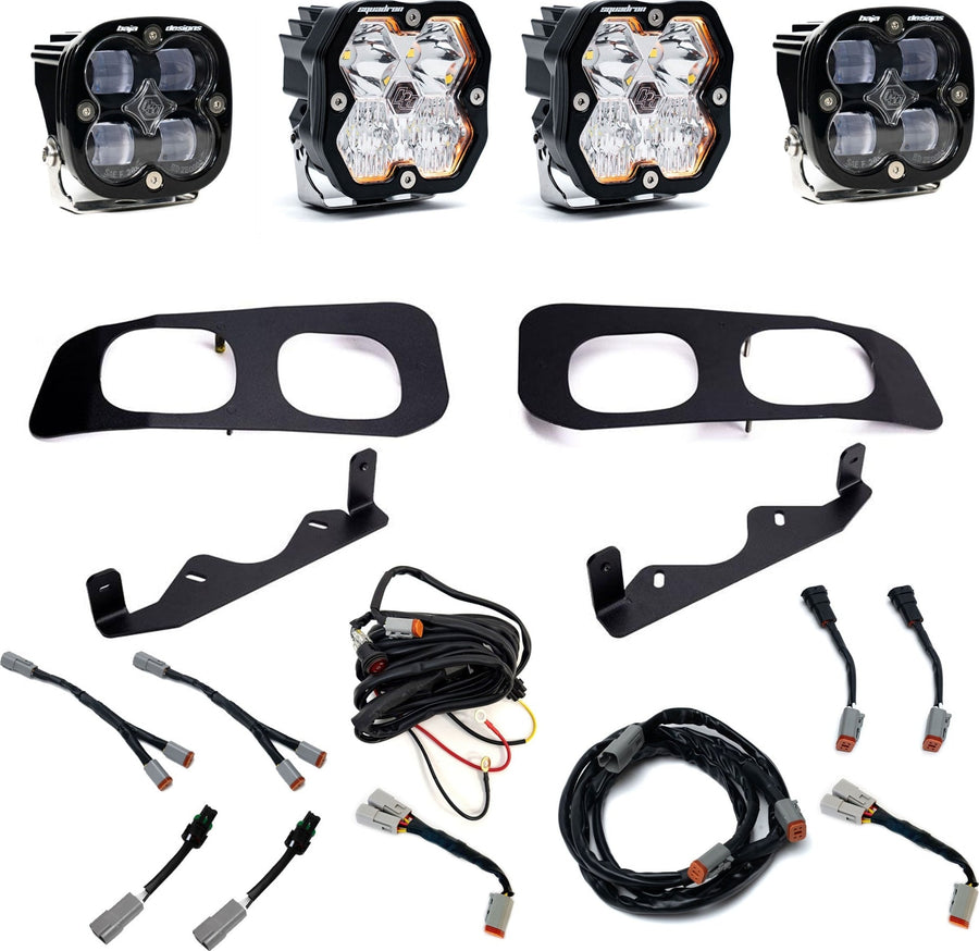 Fog Light Kits by Baja Designs: Dual fog pocket kit with four square pods, two black twin bezels, two brackets and wiring harnesses on white.