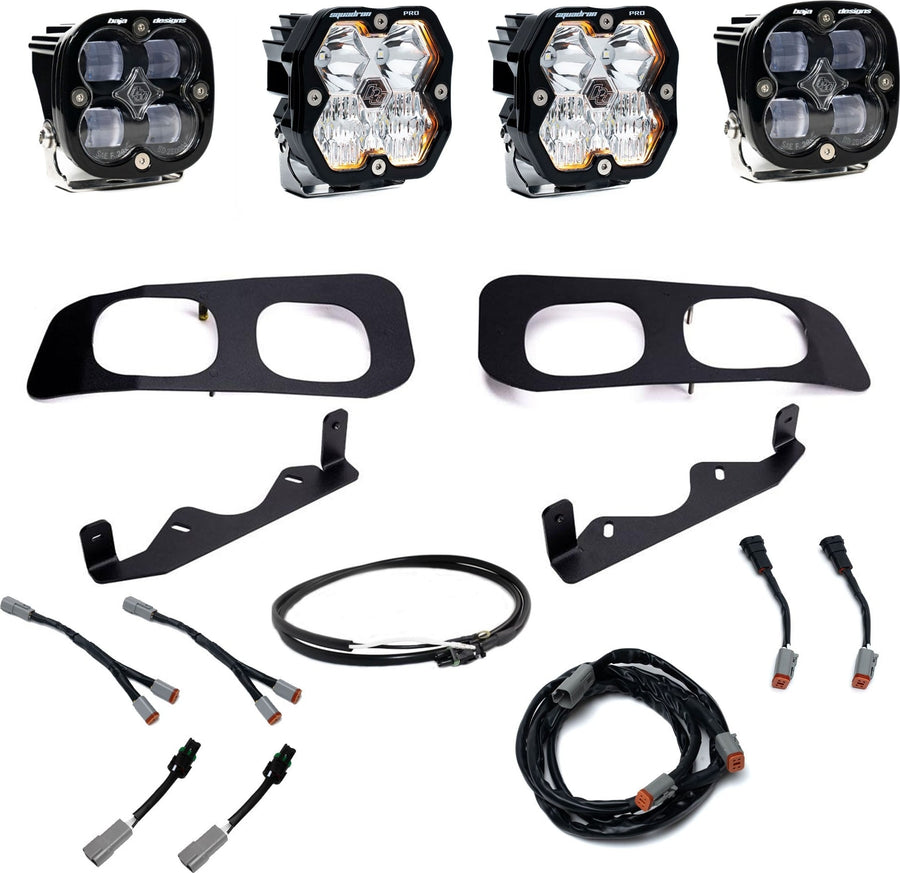 Fog Light Kits by Baja Designs: Dual fog pocket kit with four square pods, two black twin bezels, two brackets and wiring harnesses on white.