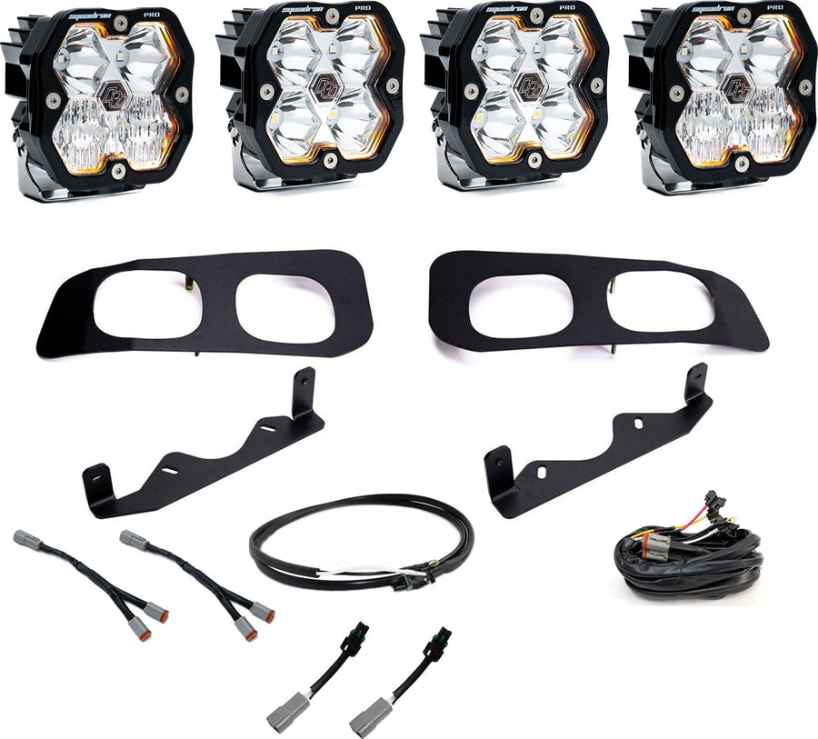 Fog Light Kits by Baja Designs: Dual fog pocket kit with four clear square Squadron Pro pods, two black twin bezels, brackets and harnesses on white.