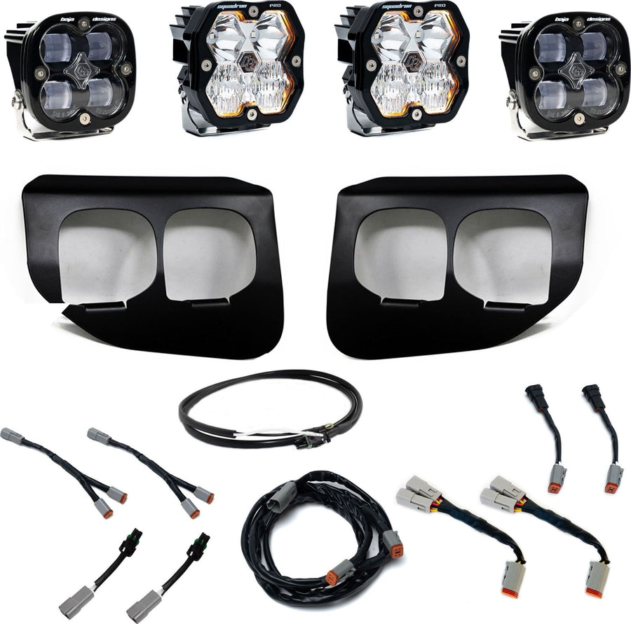 Fog Light Kits by Baja Designs: Dual fog pocket kit with four square pods, two black twin bezels and wiring harnesses on white.