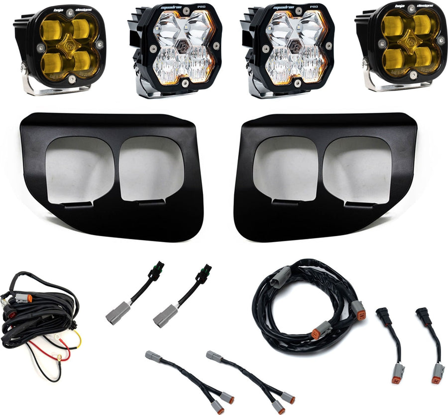 Fog Light Kits by Baja Designs: Dual fog pocket light kit with four square Squadron pods, two black dual-opening bezels, wiring harnesses and adapters on white.