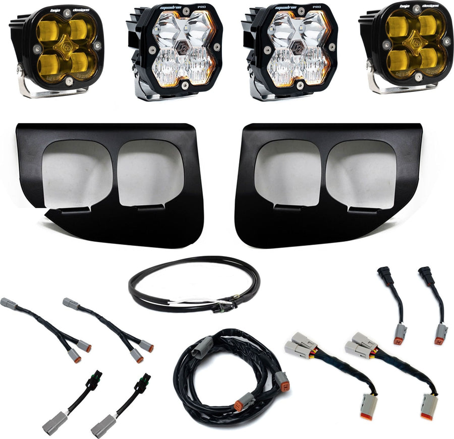 Fog Light Kits by Baja Designs: Dual fog pocket light kit with four square Squadron pods, two black dual-opening bezels, wiring harnesses and adapters on white.