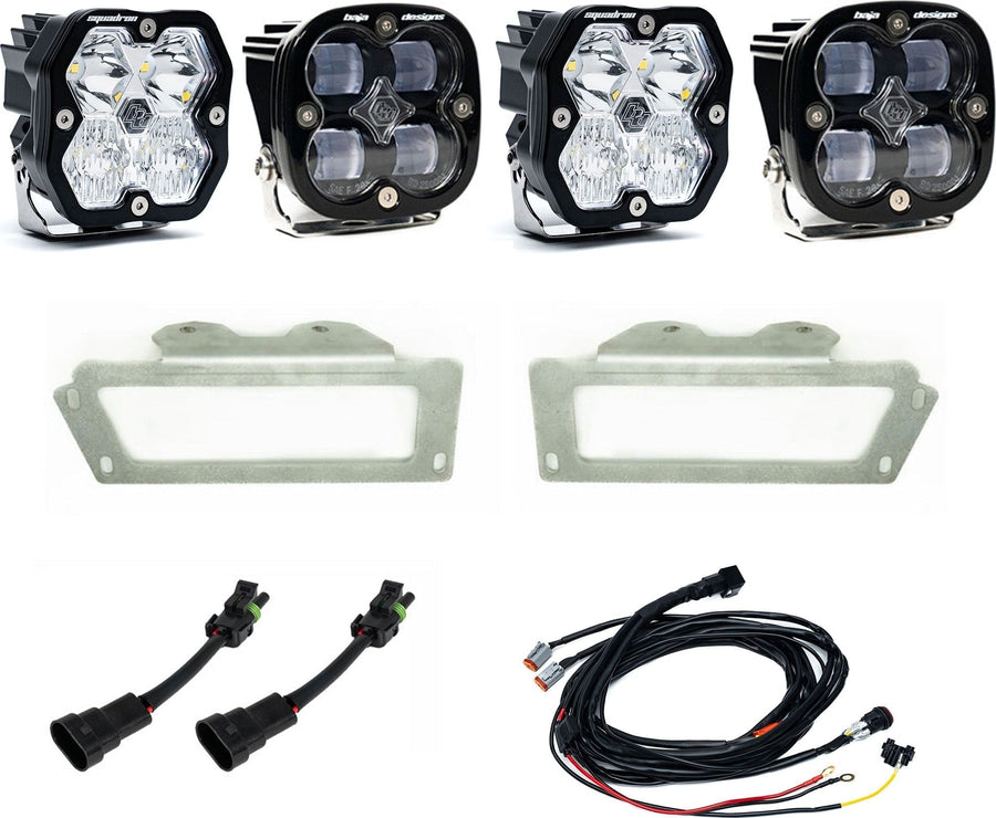 Fog Light Kits by Baja Designs: Dual fog pocket light kit with four square Squadron pods, two stainless bezel frames, adapters and wiring harness on white.
