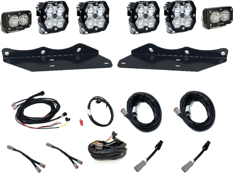 Fog Light Kits by Baja Designs: Fog pocket kit with four clear square Squadron pods, two clear S2 pods, two black mounting brackets, harnesses and adapters on white.