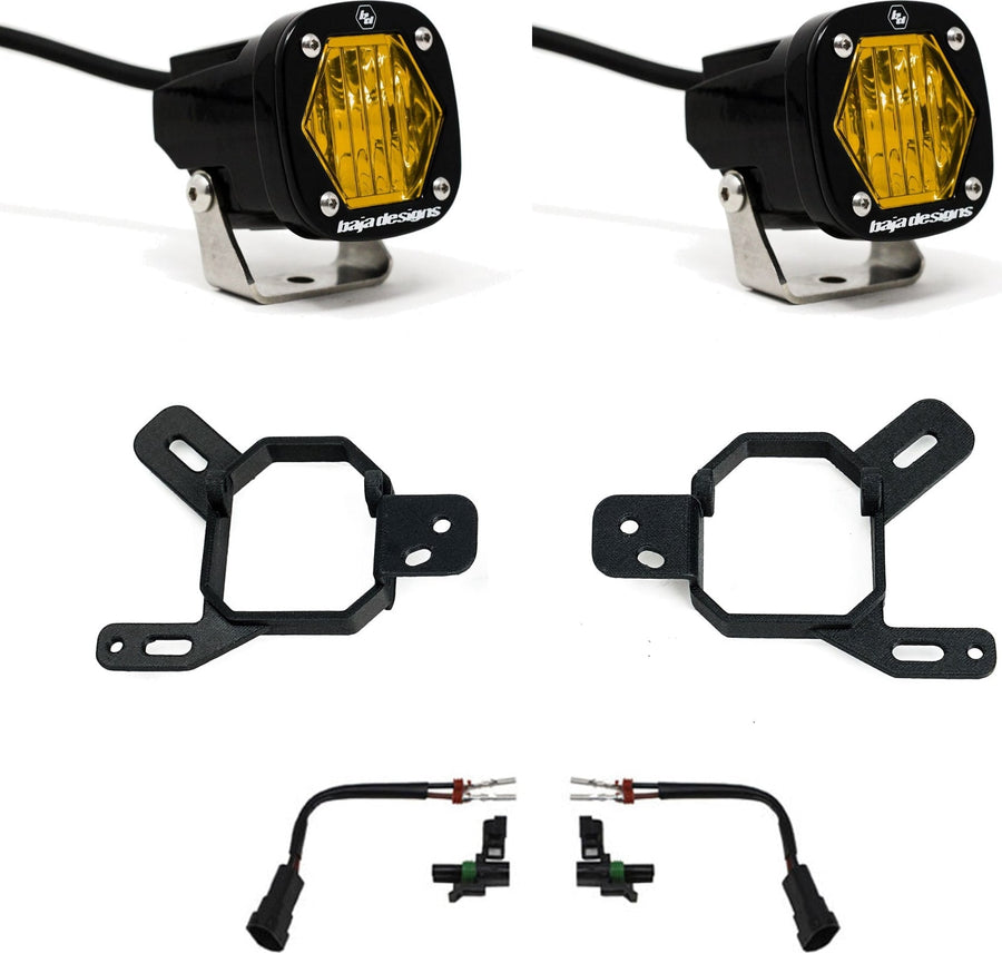 Fog Light Kits by Baja Designs: Two black S1 LED pods with amber lenses, two black fog pocket brackets and two adapter harnesses on white.