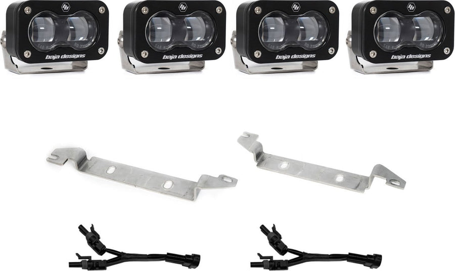Fog Light Kits by Baja Designs: Four black S2 SAE fog pods with clear lenses, two silver bumper brackets and two Y harnesses on white.
