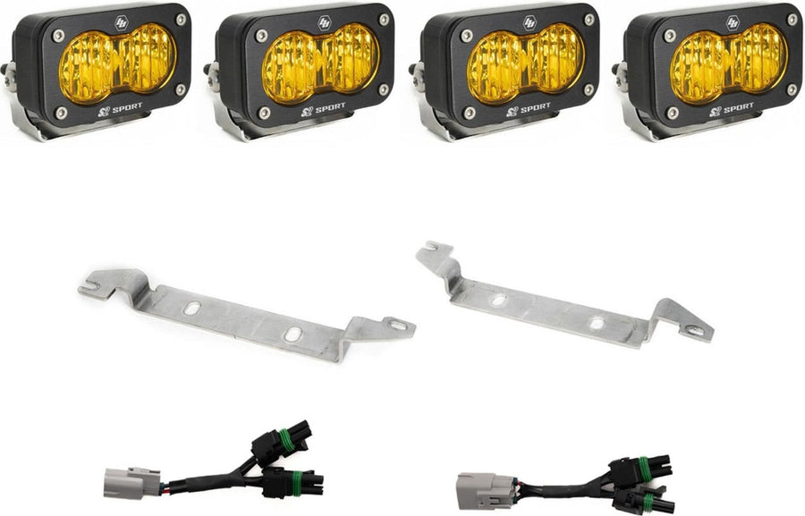 Fog Light Kits by Baja Designs: Four black S2 Sport pods with amber lenses, two silver bumper brackets and two Y harnesses with gray factory plugs on white.