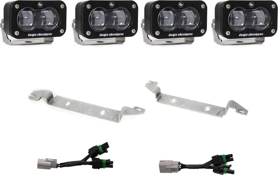 Fog Light Kits by Baja Designs: Four black S2 SAE fog pods with clear lenses, two silver bumper brackets and two Y harnesses with gray factory plugs on white.