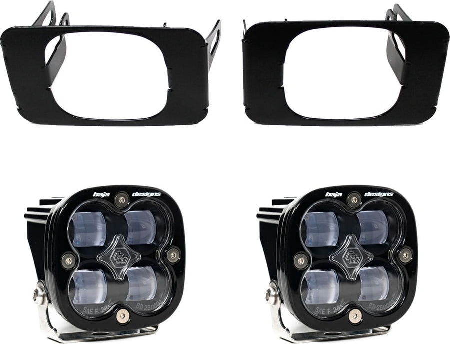 Fog Light Kits by Baja Designs: Pair of black Squadron SAE fog pods with clear lenses and two black rectangular fog pocket brackets on white.