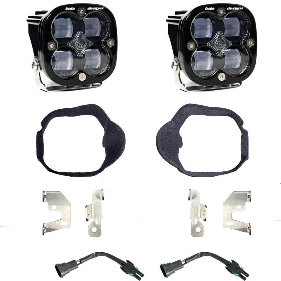 Fog Light Kits by Baja Designs: Pair of square Squadron pods with fabric-wrapped fog bezel rings, steel brackets and two pigtail harnesses, clear lenses laid out on a white background.