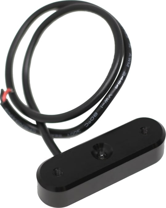 Laser & Infrared Lights by Baja Designs: A small oblong black Follow Me light pod with its attached wire lead coiled behind it on white.