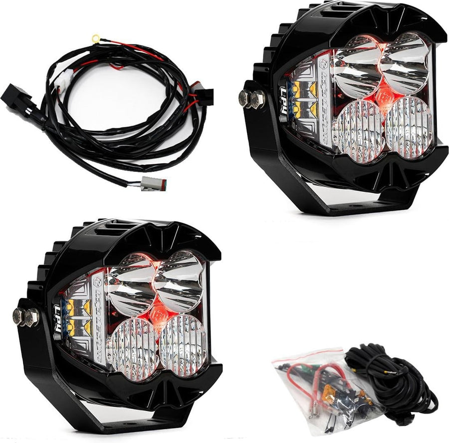 LP Light Pods by Baja Designs: A pair of LP4 Pro LED pods with clear lenses and red backlights glowing, with a wiring harness and hardware bag on white.