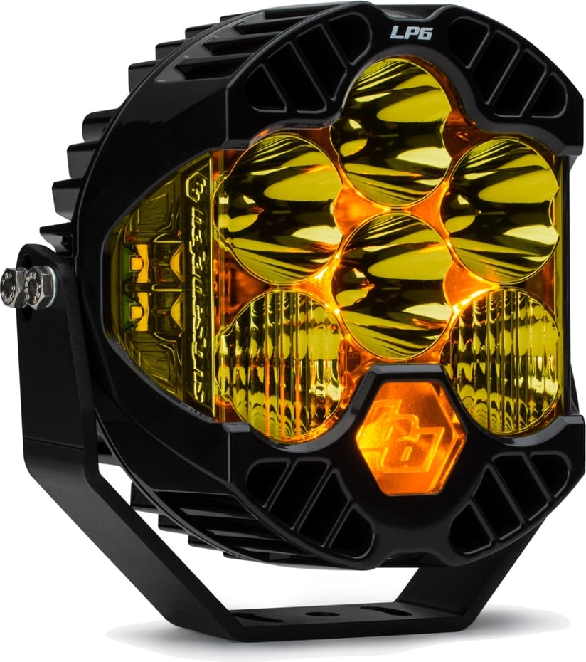 LP Light Pods by Baja Designs: Front three-quarter view of a single black LP6 Pro LED light pod amber lens, driving combo optics, amber backlight on its mounting bracket against a white background.