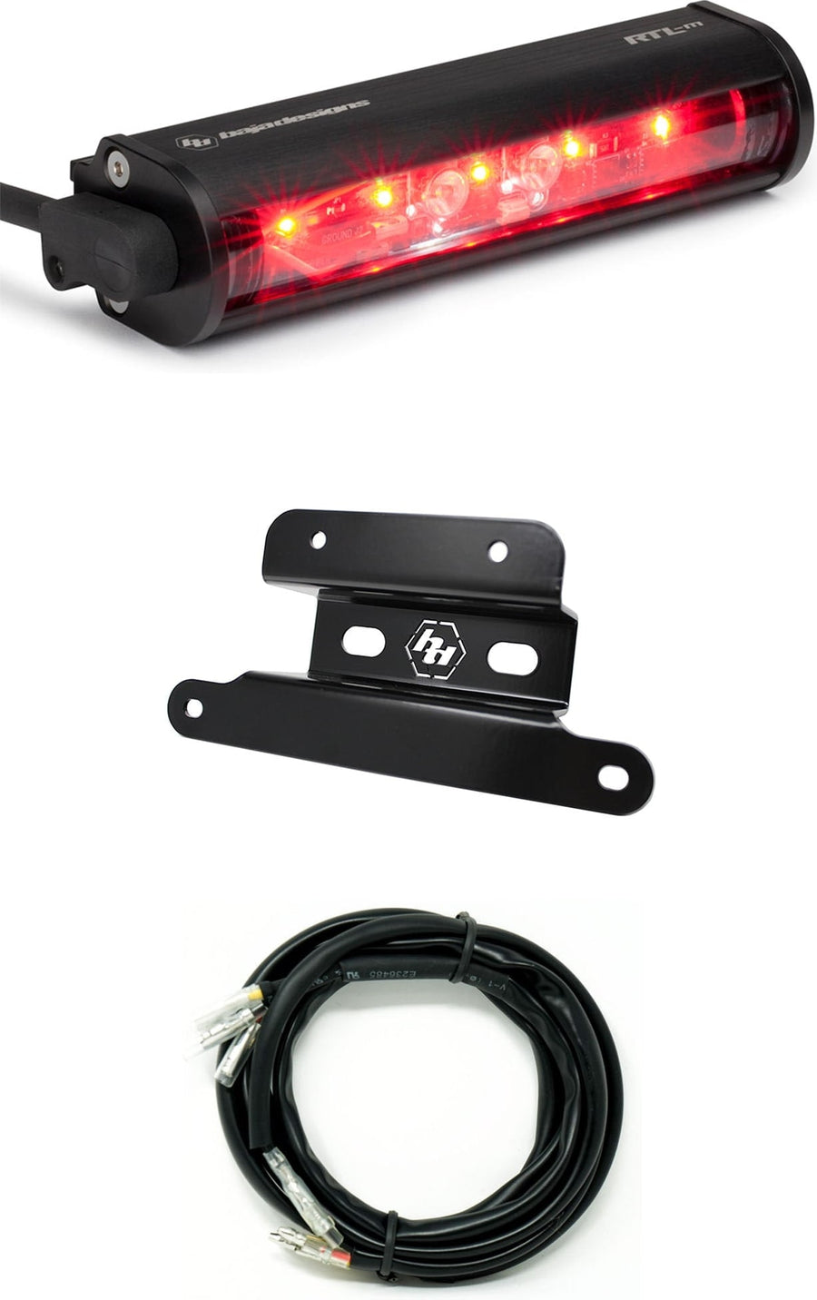 Mounts & Hardware by Baja Designs: An RTL-M rear light bar glowing red above a black Baja Designs mounting bracket and a coiled wiring harness on a white background.