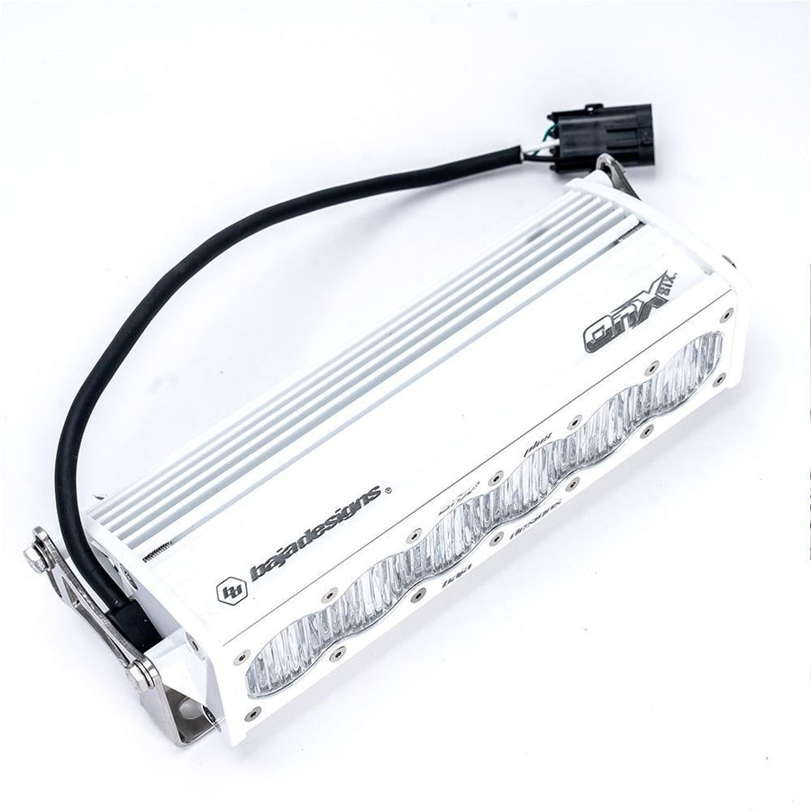 LED Light Bars by Baja Designs: Rear angle of a white Baja Designs LED light bar showing the finned housing, side bracket and wiring connector on a white background.