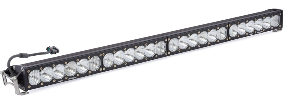 LED Light Bars by Baja Designs: Long black LED light bar with clear lenses, a wiring pigtail and end brackets on a white background.