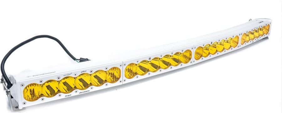LED Light Bars by Baja Designs: White OnX6 Arc curved LED light bar with amber lenses and a wiring pigtail on a white background.