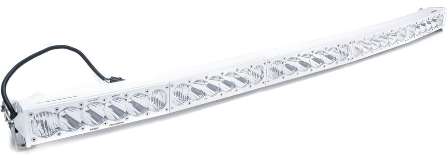 LED Light Bars by Baja Designs: White OnX6 Arc curved LED light bar with clear lenses and a wiring pigtail on a white background.