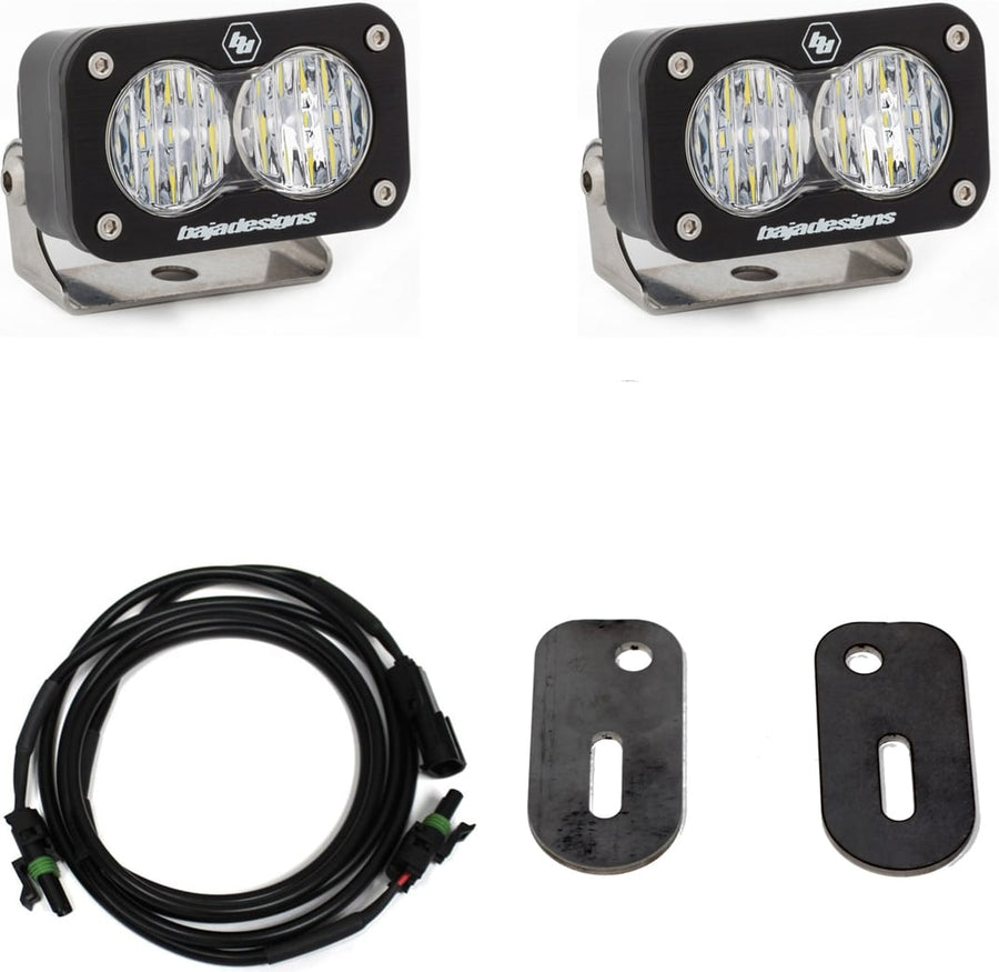 Reverse Light Kits by Baja Designs: Two S2 Sport LED pods with clear lenses, a wiring harness and two black mounting brackets on a white background.