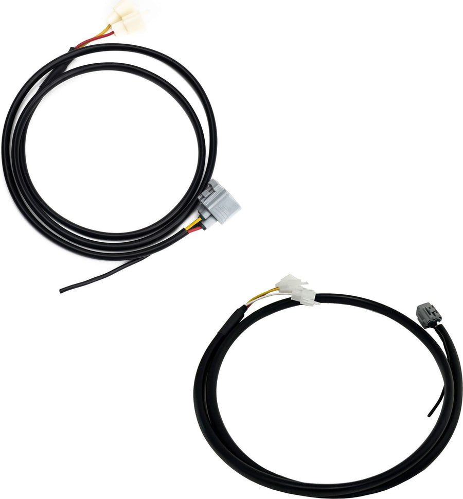 Reverse Light Kits by Baja Designs: Two coiled black upfitter wiring harnesses with gray and white connectors on white.
